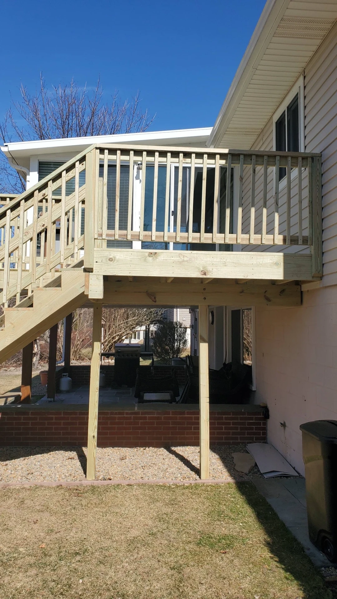 Elevated vinyl deck overlooking the yard