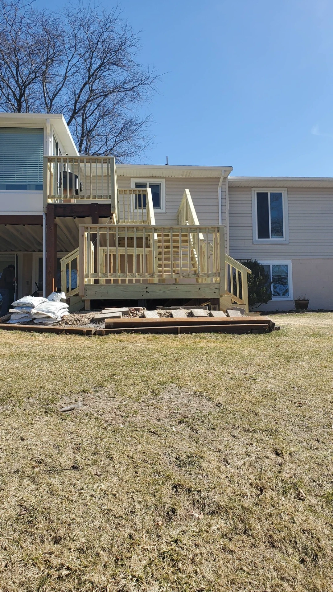 Large multi level deck and staircase system built on the back of a lake home
